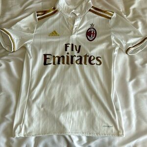 Not worn much very small hole on left shoulder